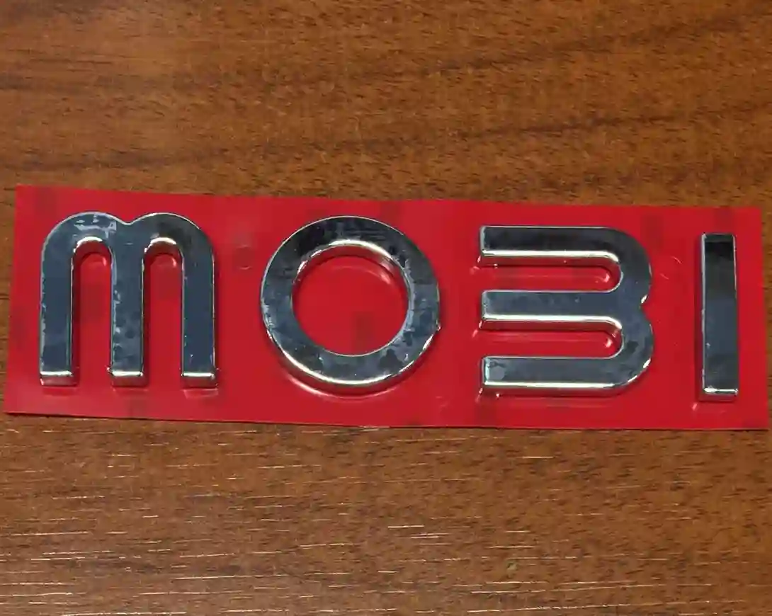 EMBLEMA PORTON FIAT MOBI 17 «MOBI»