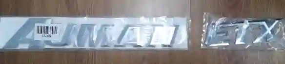 EMBLEMA «AUMAN ETX»