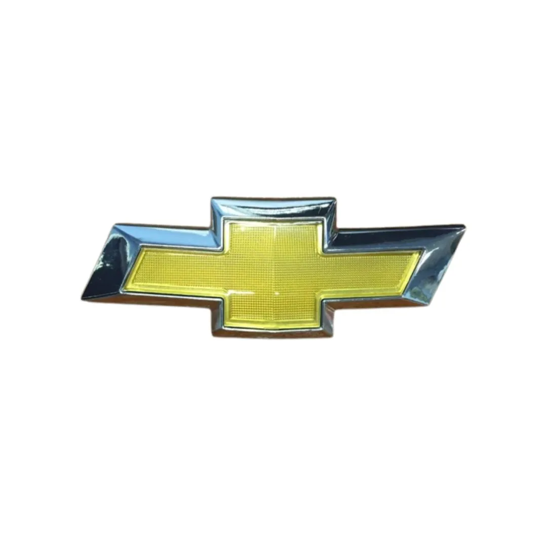 EMBLEMA CARETA GM ONIX 13
