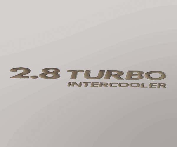 EMBLEMA 2.8 TURBO DORADO